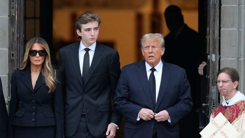 Barron stands with his family at his grandmother