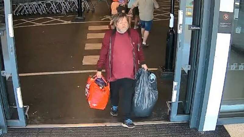 William Wilkinson carrying bags in Blackpool following the murder (Image: Lancashire Police / SWNS)