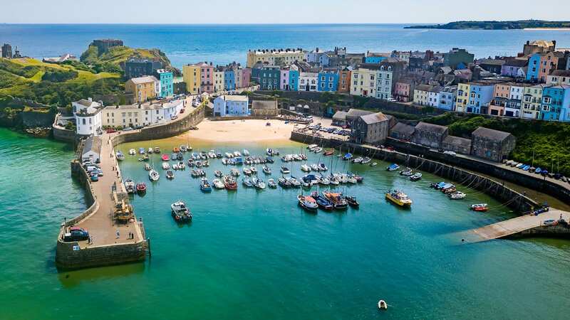 The stunning blue waters, colourful houses and friendly welcome make Tenby feel like something from a Greek island (Image: Getty Images/iStockphoto)