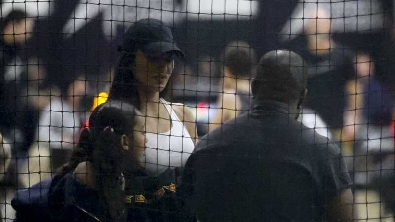 Kim Kardashian and Kanye West spoke in the stalls ahead of the basketball game, with their daughter Chicago by their side (Image: WCP,4cnrs / BACKGRID)