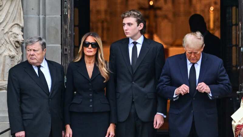 Former US President Donald Trump stands with his wife Melania Trump their son Barron Trump (Image: AFP via Getty Images)