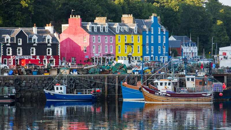 The promenade of Tobermory on the Isle of Mull and its colouful painted shops (Image: Getty Images)