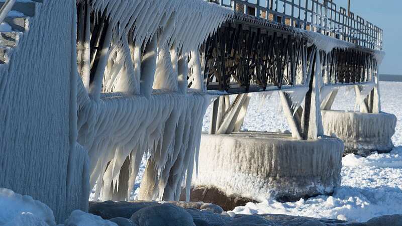 Freezing weather conditions covered a pier in ice by Lake Eire in Cleveland, Ohio back in 2014 (Image: Corbis via Getty Images)