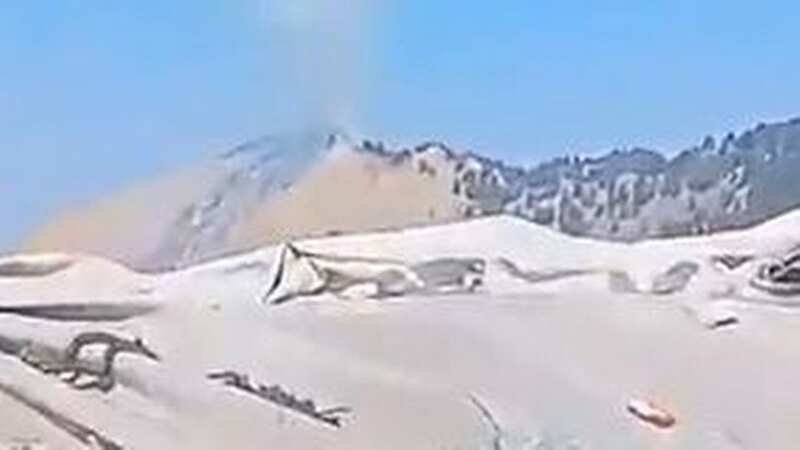 Russian TV showed the crash site, still smoking more than 12 hours after the plane reportedly went down (Image: WILL STEWART)