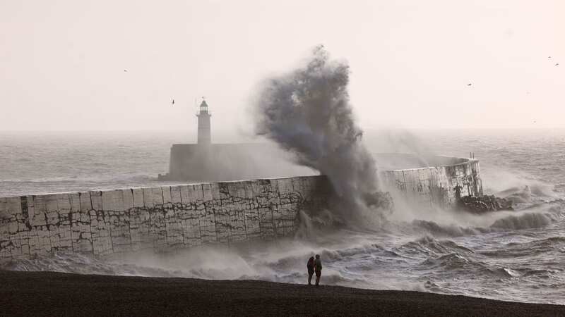Waves strike a breakwater in Newhaven, East Sussex today (Image: Getty Images)