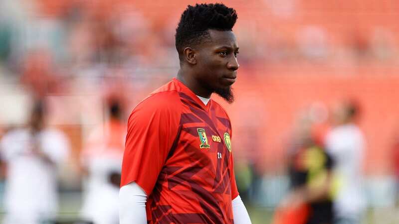 Andre Onana warms up ahead of the match between Gambia and Cameroon as he settles for a place among the substitutes (Image: KENZO TRIBOUILLARD)