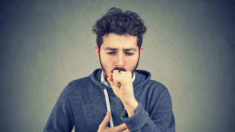 A man struggles with a cough (file image) (Image: No credit)