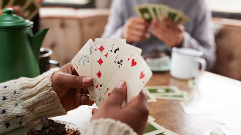 Card games can be great for boosting brain health (stock photo) (Image: Getty Images)