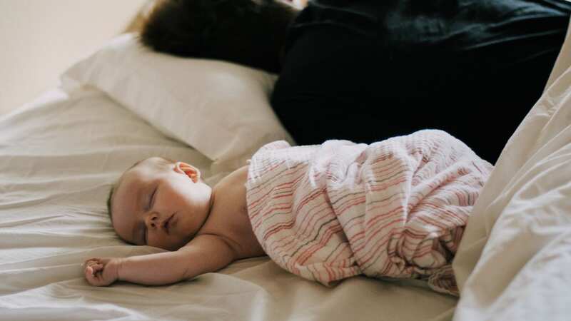 Parents have been urged to follow safe co-sleeping advice (Image: Getty Images)