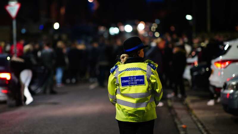 A police community support officer during a vigil near to the scene (Image: PA)