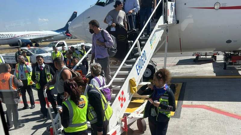 Plane passengers disembarking in Mexico City (Image: regina_villazon/Twitter)