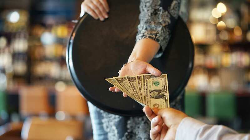 Tipping is common in restaurants for good service (Image: Getty Images/iStockphoto)