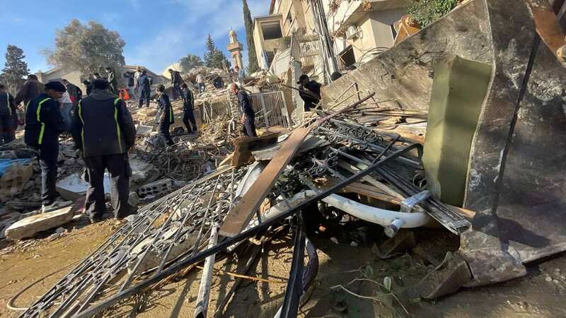 A heavy duty machine removes debris of a destroyed building after an airstrike last week (Image: Anadolu via Getty Images)