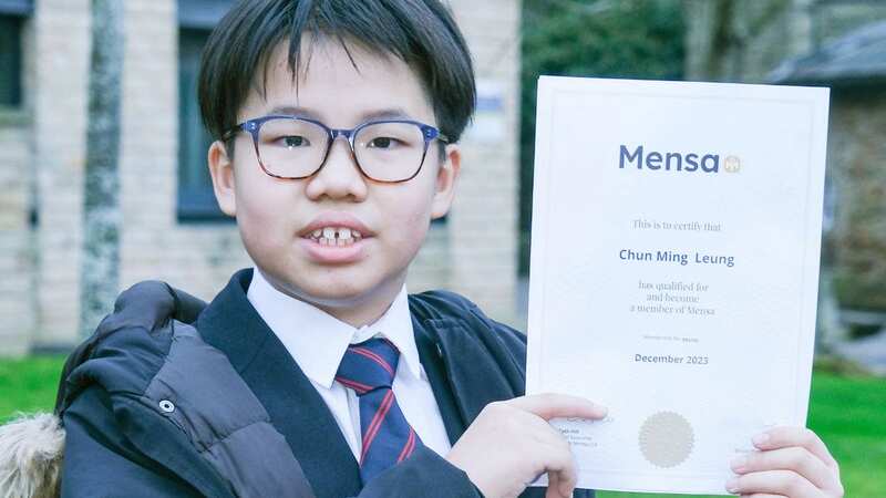 Cyrus Leung with his test result (Image: Dean Atkins Photography / SWNS)