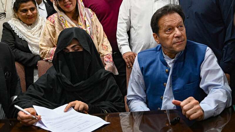 Imran Khan and his wife Bushra Bibi were hit with a 14-year prison sentence today (Image: AFP via Getty Images)