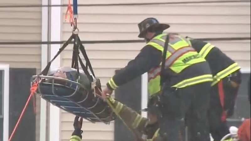 The woman was rescued by firefighters (Image: WMUR)
