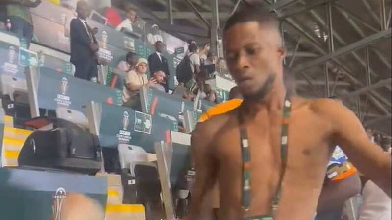 A journalist was filmed dancing after Ivory Coast beat Senegal (Image: Twitter / @MezahiMaher)