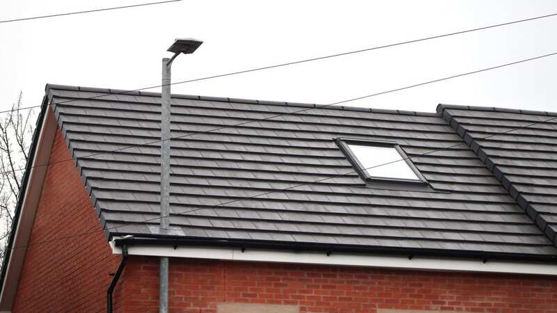 The lamppost goes through the roof of the newbuild property (Image: GARY CARTER)