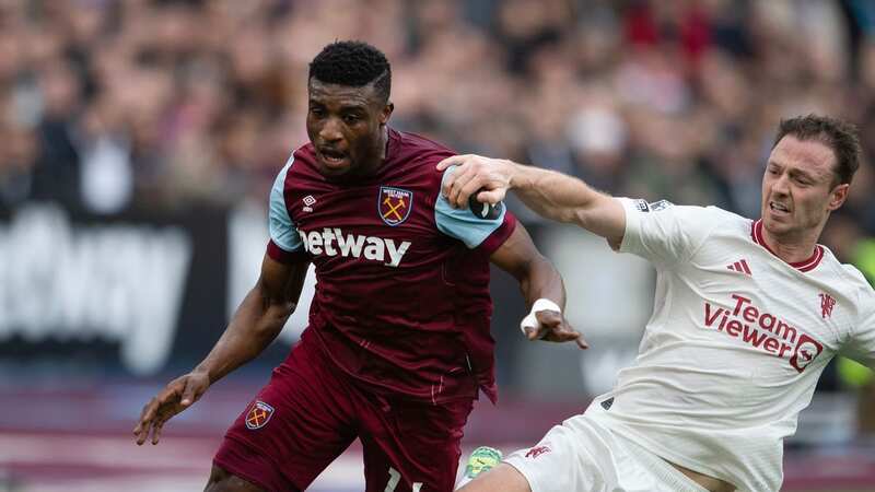 LONDON, ENGLAND - DECEMBER 23: Mohammed Kudus of West Ham United (L) is tackled by Jonny Evans of Manchester United (R) during the Premier League match between West Ham United and Manchester United at London Stadium on December 23, 2023 in London, England. (Photo by Visionhaus/Getty Images) (Image: Visionhaus/Getty Images)