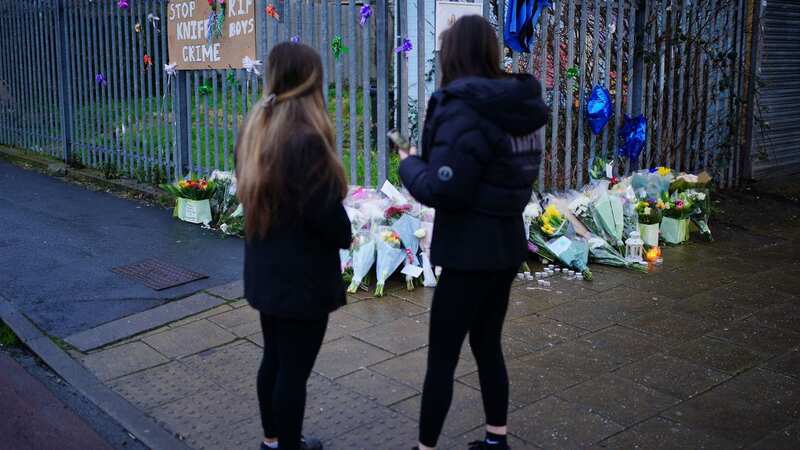 Flowers near to the scene in south Bristol where two teenage boys, aged 15 and 16, died after a stabbing attack (Image: PA)