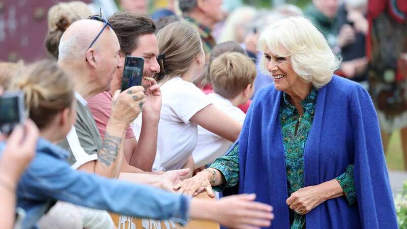 Queen Camilla appears happy and open in front of crowds (Image: Getty Images)