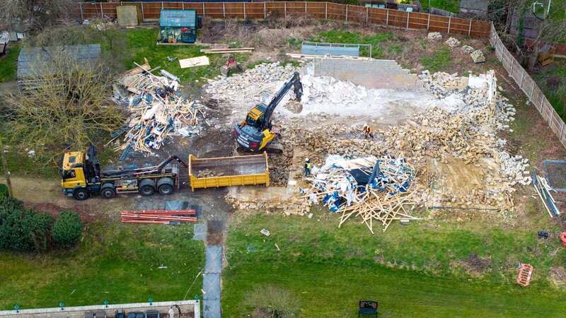 A dumper truck stands ready to remove rubble from the former spa building (Image: Bav Media)