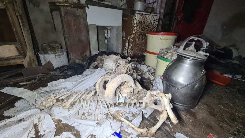Inside abandoned home filled with coffins and skeletons with clothes left behind