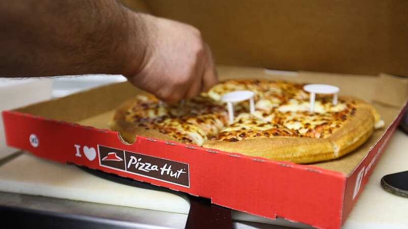 People have been wondering why pizza boxes are square when the food inside them is round (Image: Bloomberg via Getty Images)