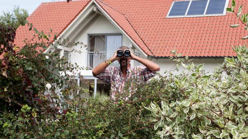 The woman feels her neighbour is keeping a constant watch on home (Image: Getty Images/Westend61)