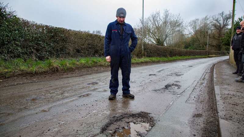 There are 174 craters in just one 200-metre section of road, locals say (Image: William Lailey SWNS)
