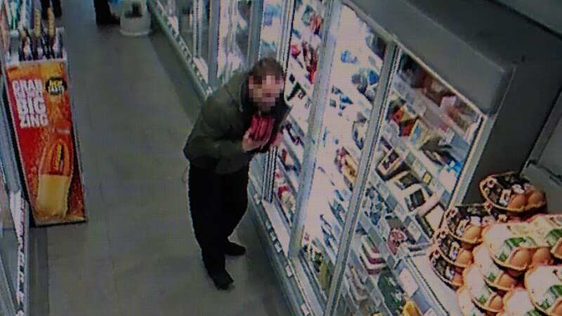 An unidentified alleged shoplifter filmed taking items (Image: Andy Stenning/Daily Mirror)