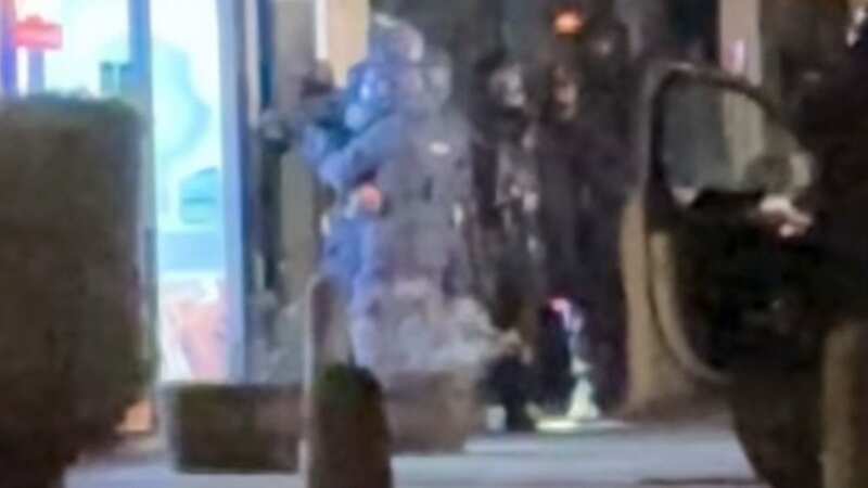 Armed police hunting Abdul Ezedi raid pizza restaurant 300 miles away from scene