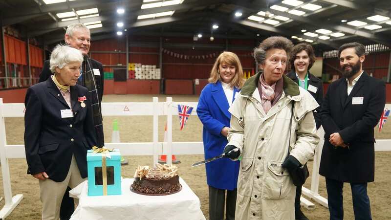 Anne cuts the cake to celebrate Wormwood Scrubs Pony Centre