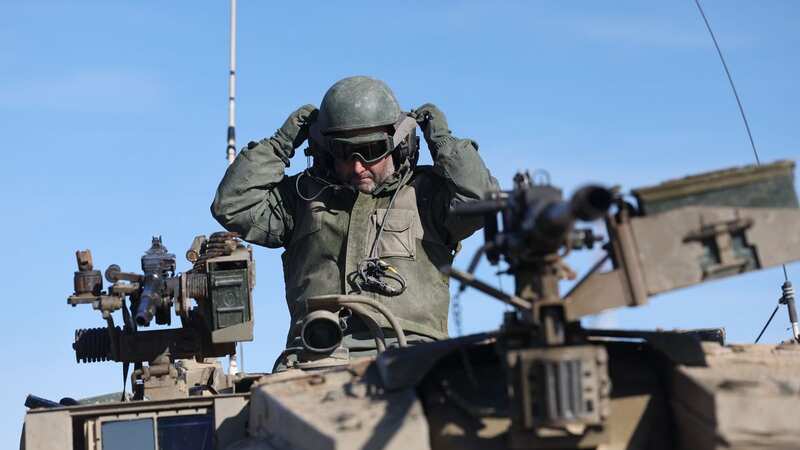 An Israeli soldier sits atop their tank near the Israeli border with Gaza Strip (Image: ABIR SULTAN/EPA-EFE/REX/Shutterstock)
