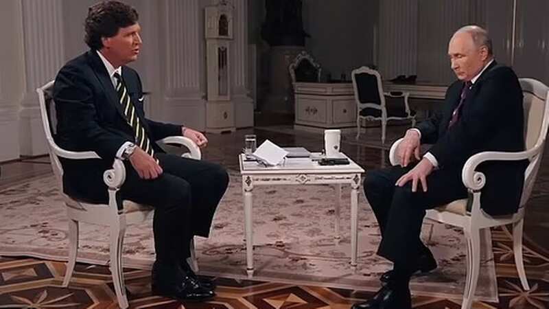 Putin forced to hold down his shaking leg in Tucker Carlson interview