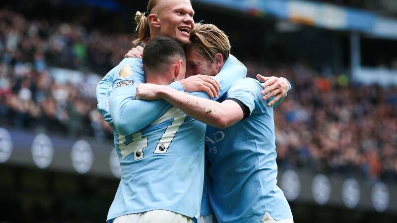 Erling Haaland of Manchester City celebrates with Kevin De Bruyne and Phil Foden after scoring his side