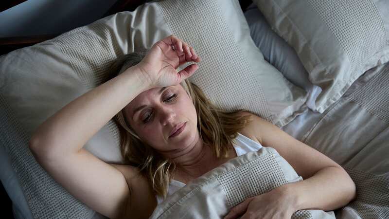 A woman struggles to get to sleep (file image) (Image: Getty Images)