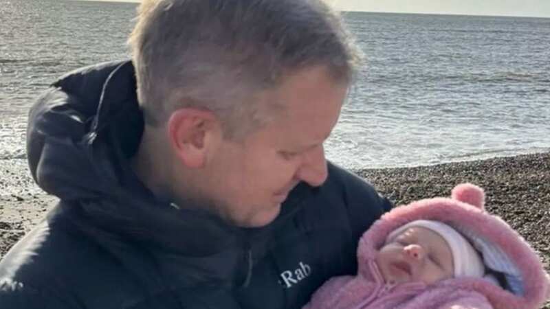 Jeremy Kyle full of emotion as he cradles adorable newborn daughter