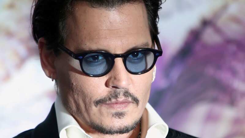 Johnny Depp has topped a list of glasses-wearing celebrities with the most stylish specs (Image: SWNS)