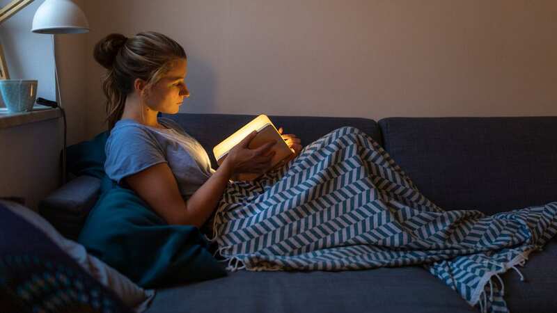 I tried a neck light to make reading at night easier (Image: Getty Images/Westend61)