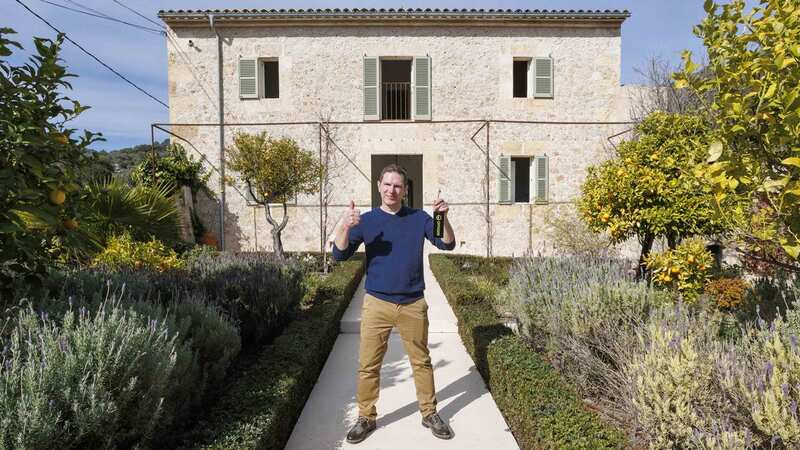 Graham Dunlop outside his new villa in Spain (Image: OMAZE / SWNS)