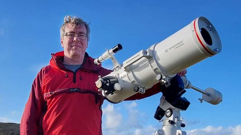 Stephen McAllister with his telescope - not the Aldi one (Image: Stephen McAllister / SWNS)