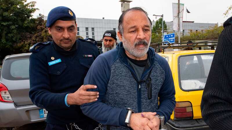 Piran Ditta Khan being hauled to an extradition hearing in Islamabad (Image: Daily Mirror/Andy Stenning)