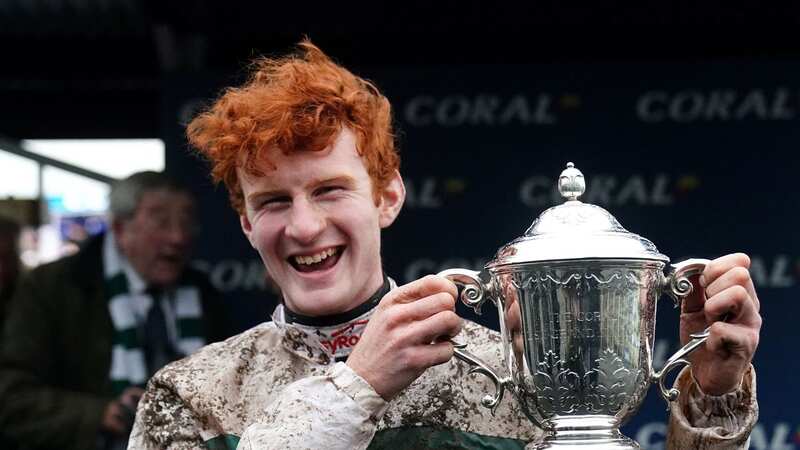 Caoilin Quinn with the 2023 Coral Welsh Grand National trophy after Nassalam
