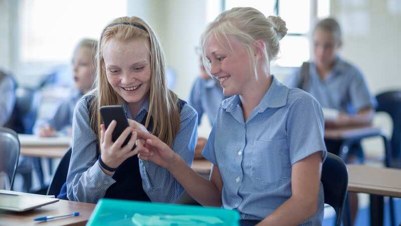 Teachers have been told to give children lessons on the downsides of using mobile phones at school (Image: Getty Images/Westend61)