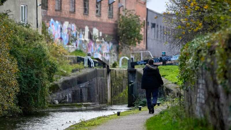People walk along a canal tow path in Hodge Hill in Birmingham (Image: Getty Images)
