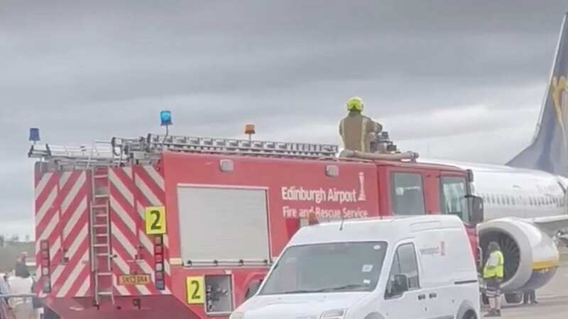 Ryanair passengers were forced off the plane as fire crews were scrambled to the jet (Image: Supplied)