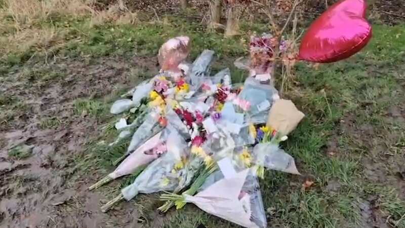 Flowers, messages and balloons at the country park in Solihull
