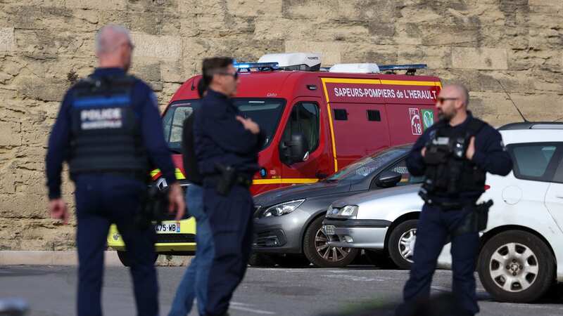 Cops outside the court building in Montpellier (Image: AFP via Getty Images)