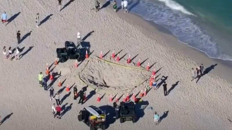 A young girl died after a sand hole she was digging collapsed (Image: CBS)